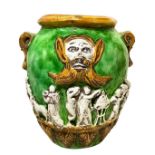 Cachepot in green and yellow majolica with white bas-relief figures. Caltagirone. 20th century, H 45