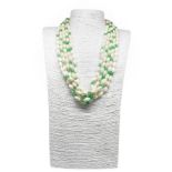 Necklace with five threads of narrowed ivoryolin with jade mm leased mm. Gold lacquered silver lock.