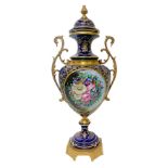 Porcelain vase, Sevres style, in blue color with golden handles and floral decorations. H cm 61. H 6