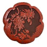 Lacquered box in China red. Low relief floral decoration. Diameter 25 cm, h cm 5.5