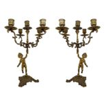 Pair of candlesticks in gilded brass with 5 lights supported by cherubs, late 19th century. H 37 cm.