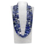 Three strand necklace composed of square elements of 16x16 mm sodalite and silver lock. Length 84 cm