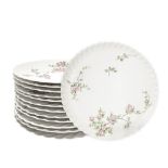 Set of dessert plates, France Limoges. Composed of cake pan and 12 white porcelain saucers and flora