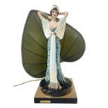 Table lamp with leaf shaped lampshade equipped with a woman statuette in Liberty clothes. Signed on