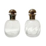 Pair of cordonated glass bottles with silver metal cap. H cm 23. Production Italy. Italy, H 23 cm