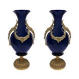 Pair of blue porcelain vases, with gold bronze applications.