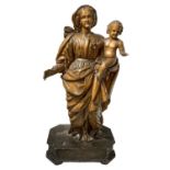 Wooden sculpture depicting Virgin Mary with child.