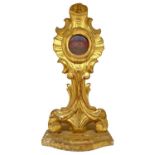 Reliquary in golden leaf wood.