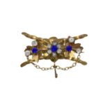 Low-grade gold brooch with colored stones