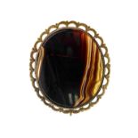 Ancient gold oval brooch with agate