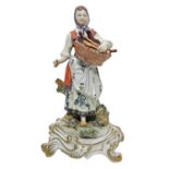 Capodimonte statue depicting woman selling spoons.