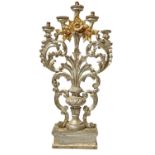 Candlestick in silver and golden wooden five candles, figured in vase with leaves and flowers.