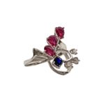 White gold ring with 3 rubies, 1 blue sapphire and 3 diamonds