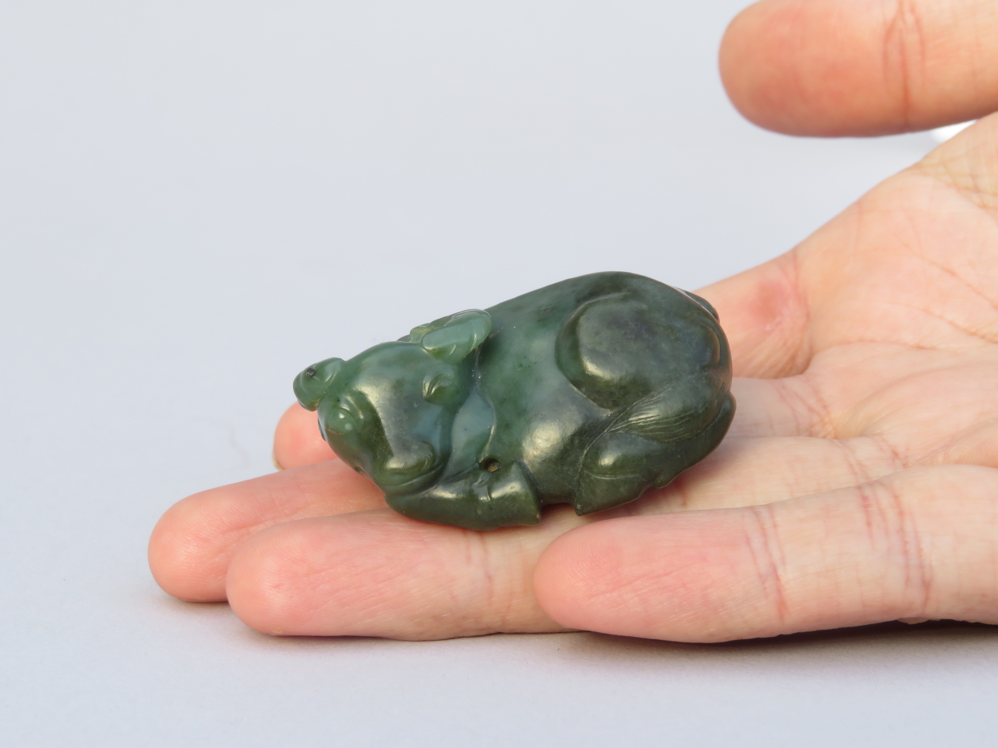 A CHINESE GREEN JADE CARVING OF A RECUMBENT WATER BUFFALO, QING DYNASTY - Image 9 of 13
