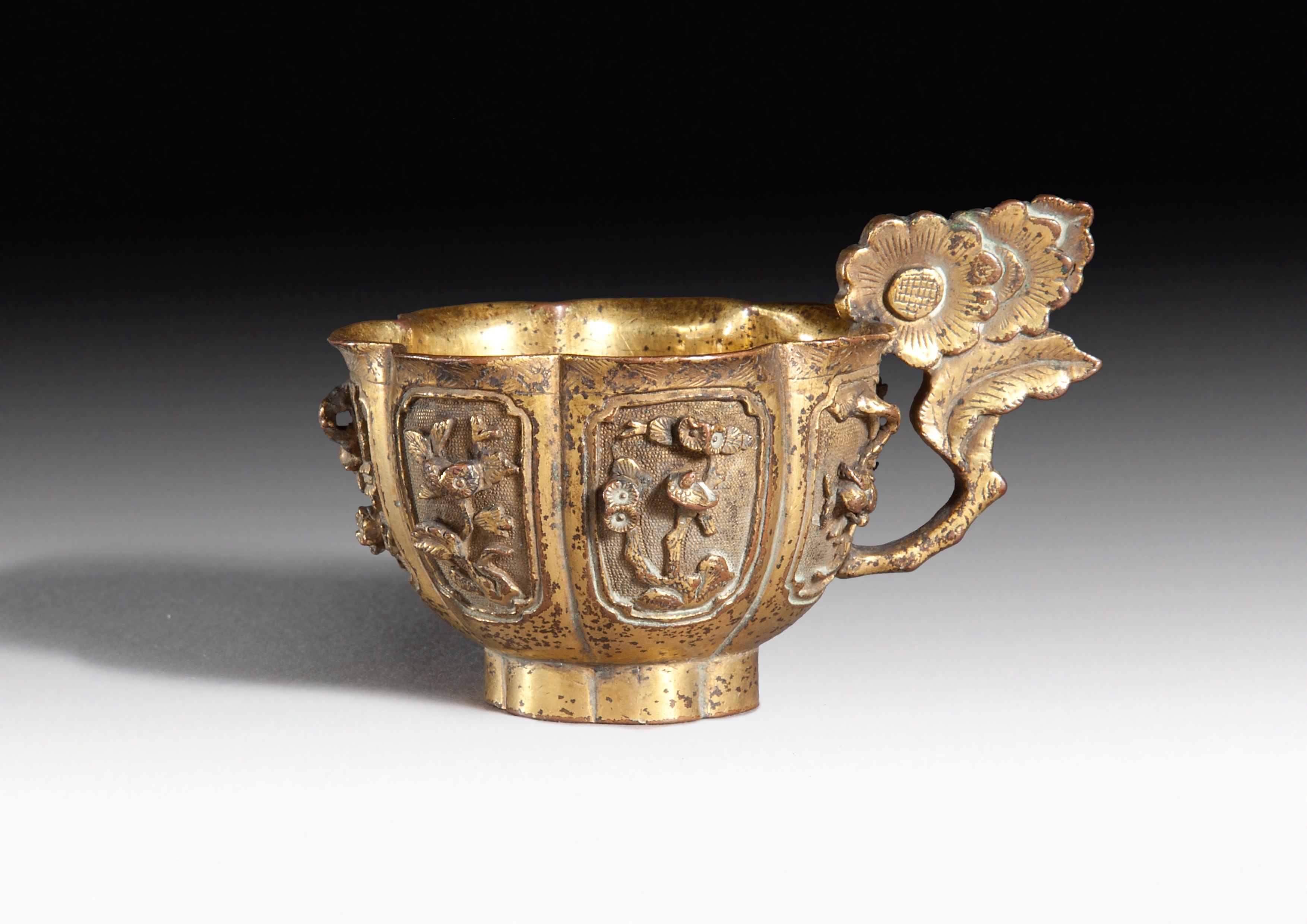 A SMALL CHINESE GILT-BRONZE CUP, QING DYNASTY, 17TH CENTURY