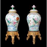 AN EXCEPTIONAL PAIR OF LARGE CHINESE PORCELAIN BALUSTER VASES AND COVERS, QING DYNASTY, EARLY QIANLO