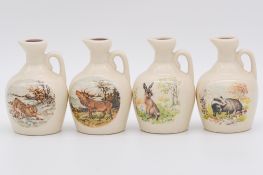 Twenty two assorted Rutherford's white ceramic decanters
