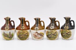 Twenty one assorted Rutherford's ceramic decanters, birds and animals