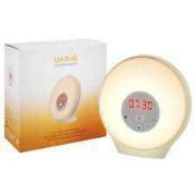 RRP £90 Lot To Contain A Boxed Lumie Sunrise Alarm And A Boxed Astro Ceramic 3 Tiered Oval Wall Ligh