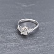 RRP £7,500 - 1.35Ct Princess Cut Diamond 0.25Ct Pear Shape Diamond Each Side Of The 18Ct White