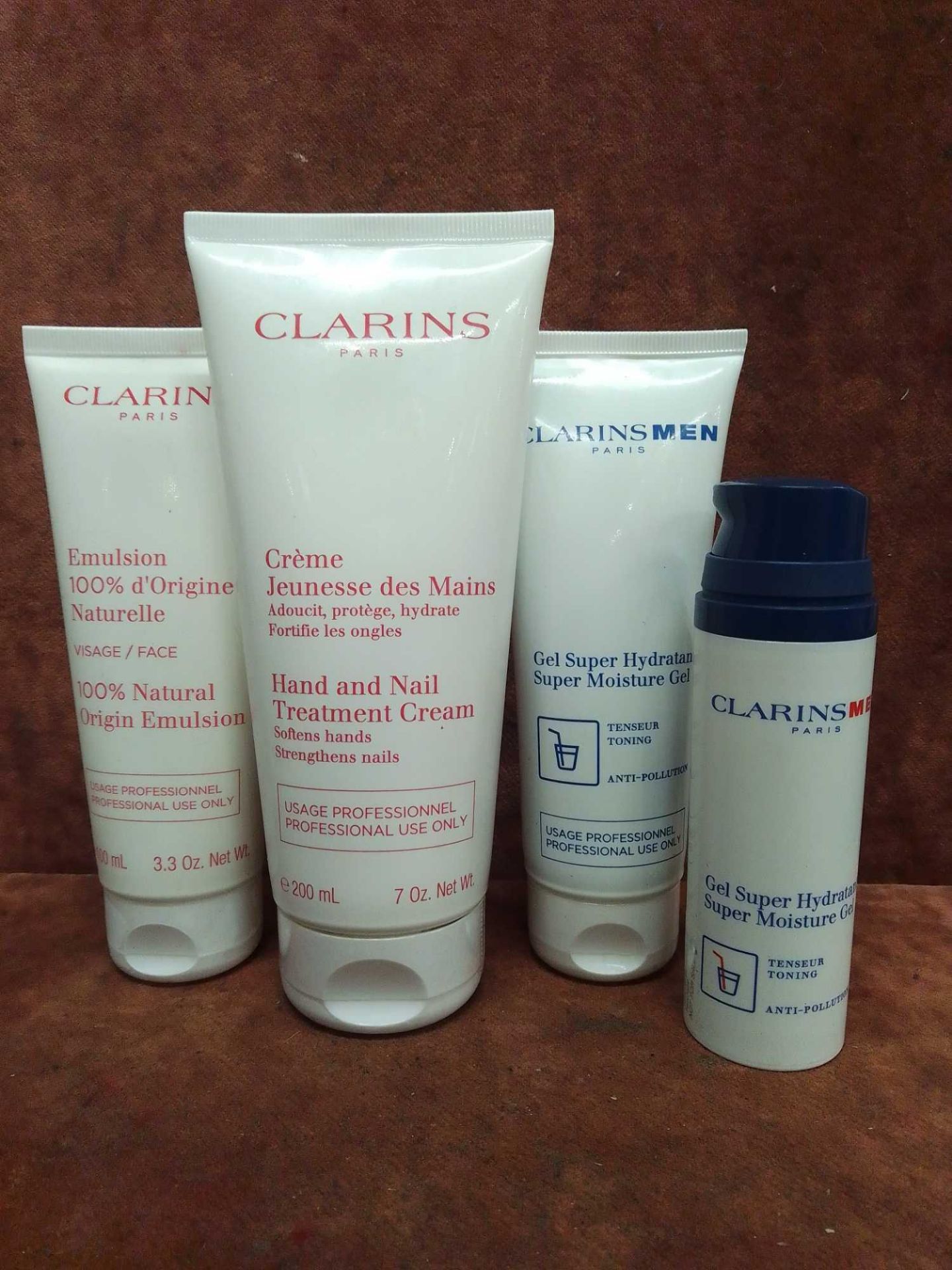 (Jb) RRP £215 Lot To Contain 4 Testers Of Assorted Premium Clarins Products To Include 200Ml Hand An