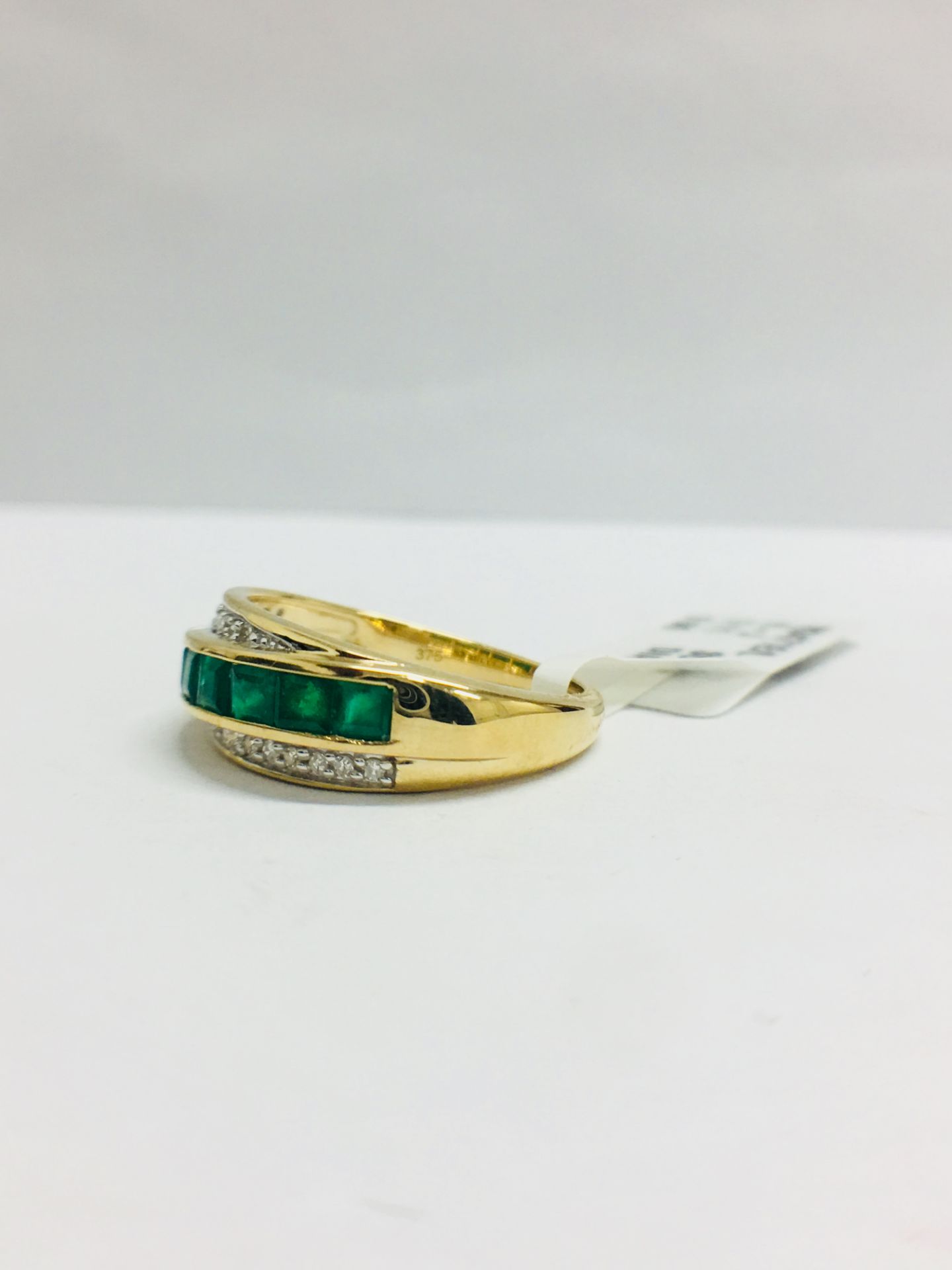 9Ct Yellow Gold Diamond Emerald Crossover Style Ring - Image 2 of 7