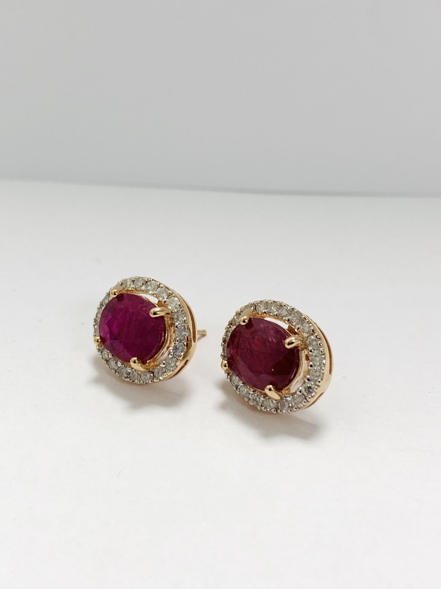 14Ct Rose Gold Ruby And Diamond Halo Earring