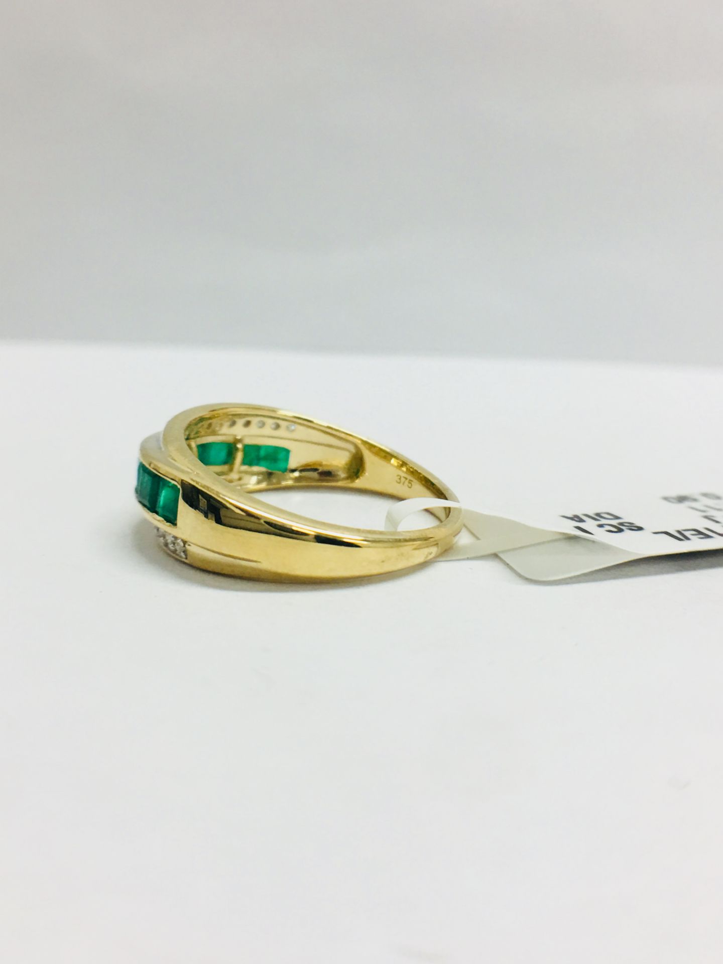 9Ct Yellow Gold Diamond Emerald Crossover Style Ring - Image 3 of 7