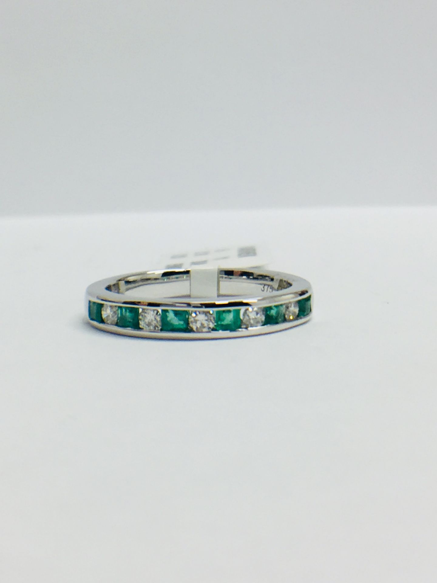 9ct White Gold Emerald Diamond Channel Set Eternity Ring