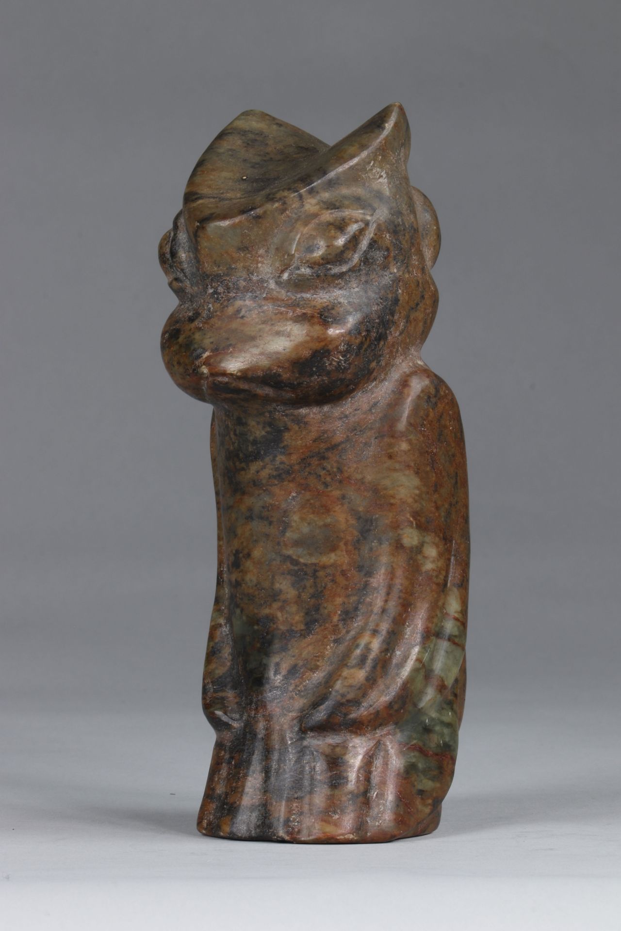 China dignitary in brown-green jade, with the animal head, in double face; archaic work