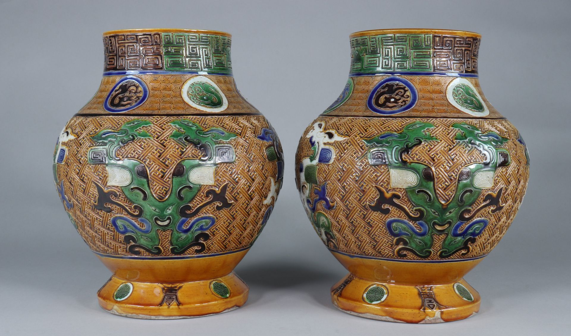 Pair of Fahua Tongzhi vases decorated with dragons in relief