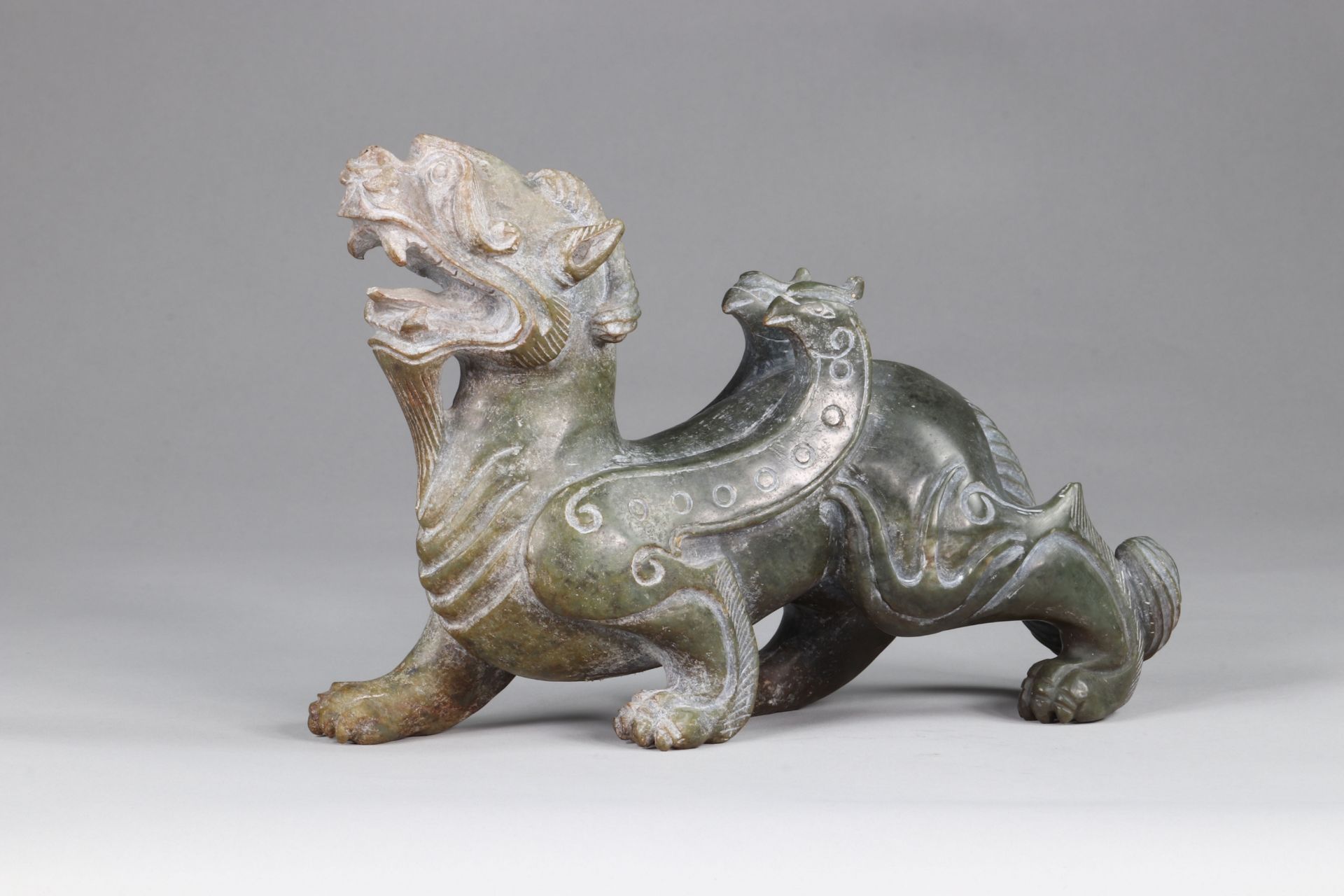 China A ferocious beast representing a couple with dragon and Phoenix archaic work