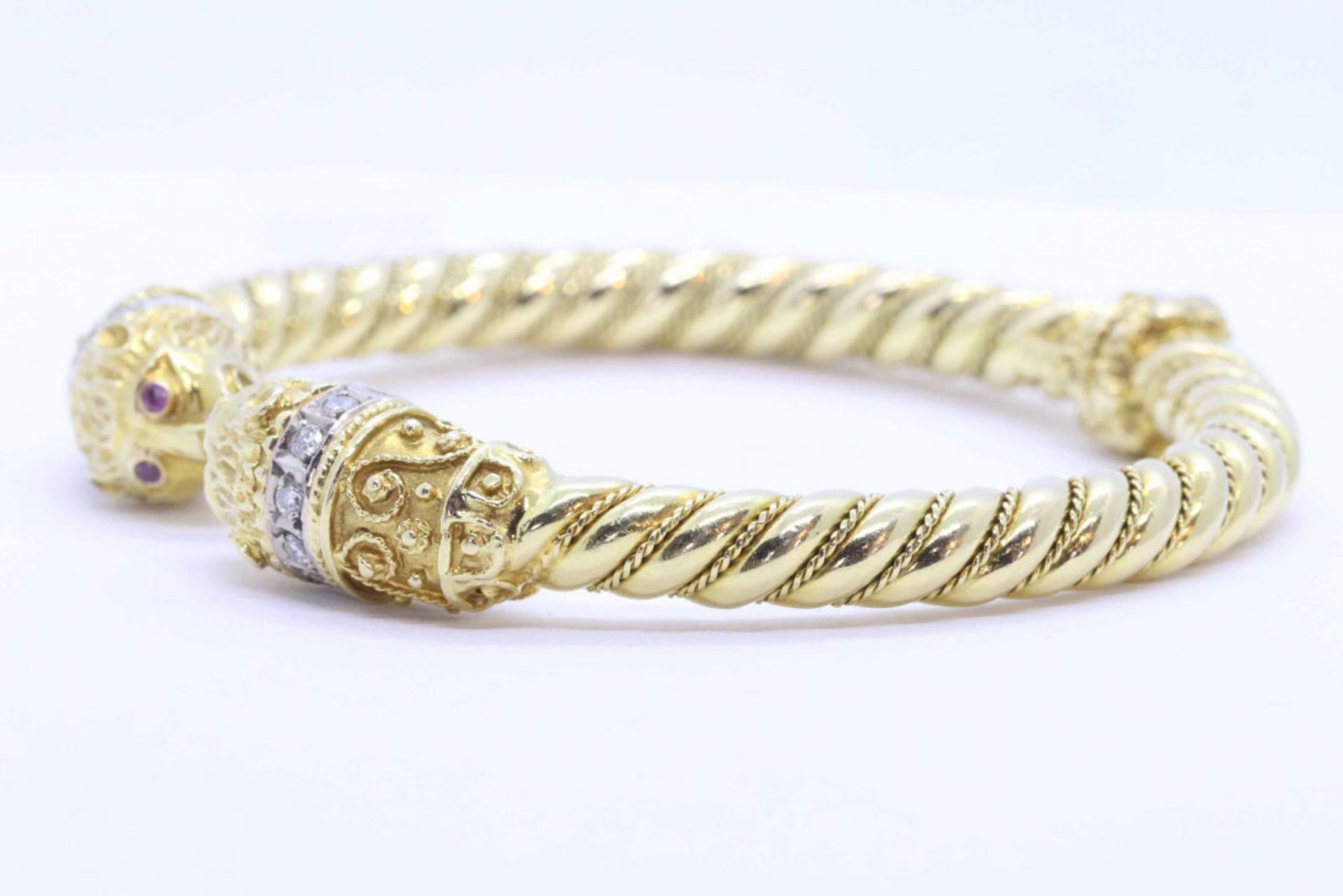 Contemporary bracelet in 18K yellow gold, set with diamonds and rubies