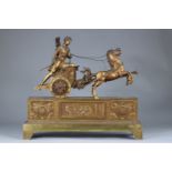 PENDULUM CALLED "AU CHAR" in gilded and chased bronze. It represents Apollo on his chariot