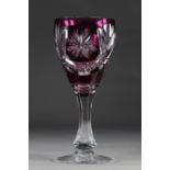 Val Saint Lambert large glass on a finely cut stem on a mauve background