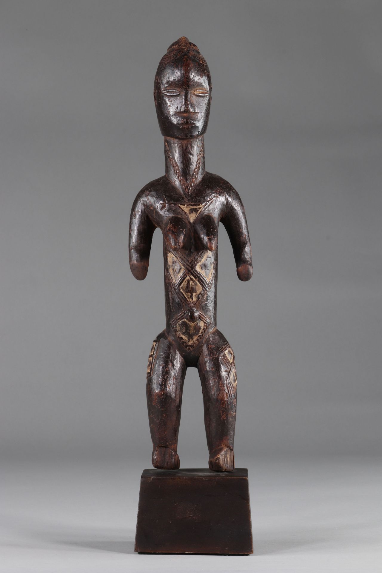 Bete, Republic of Côte d'Ivoire, nude female statuette with ancestral scarifications, wood, old brow