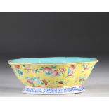 China famille rose bowl decorated with peaches on a yellow background 19th C.