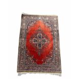 Keshan Souf carpet in polychrome floral embroidered silk on a red background, border decorated with