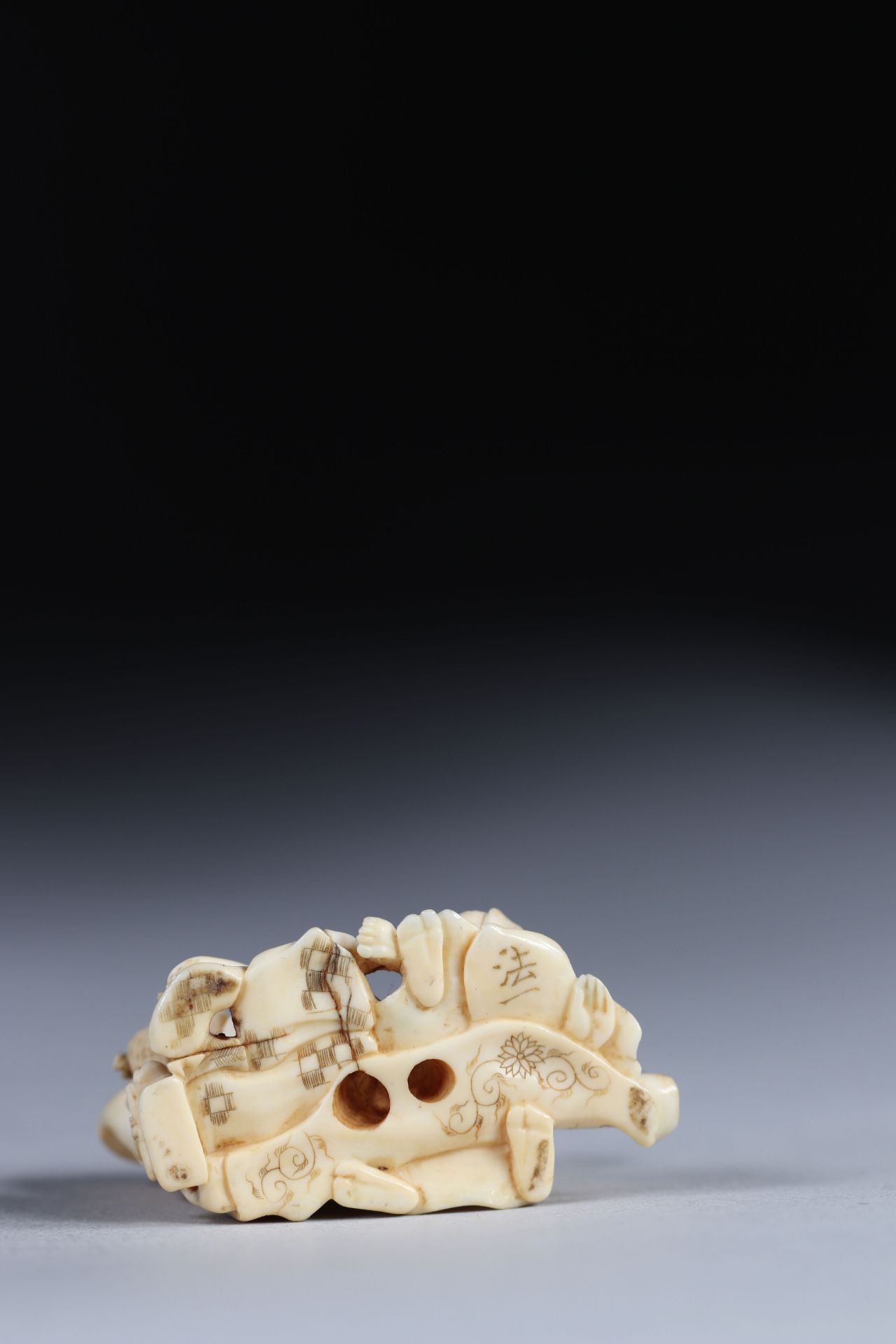 Netsuke carved from a group - figures. Japan Meiji period around 1900 - Image 3 of 3