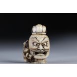 Netsuke / Okimono carved - a scaled samurai head. Japan Meiji period late 19th