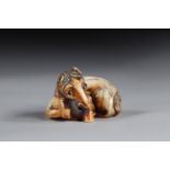 Netsuke carved - a recumbent horse. Japan Edo period