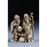 Netsuke carved from a group - figures. Japan Meiji period around 1900