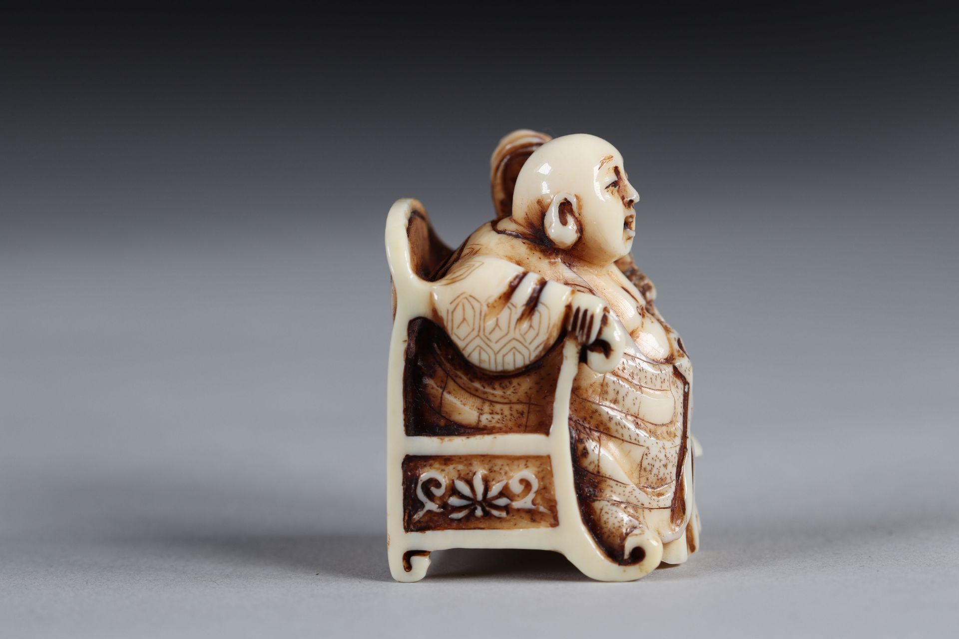 Netsuke carved - a Buddha seated on a throne. Japan Meiji period late 19th signature - Image 2 of 5