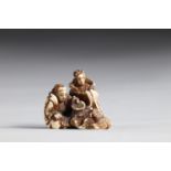 Netsuke carved - figures feeding a feathered turtle. Japan Edo period signature