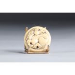 Netsuke Manju circular carved - a horse. Japan Meiji 19th century