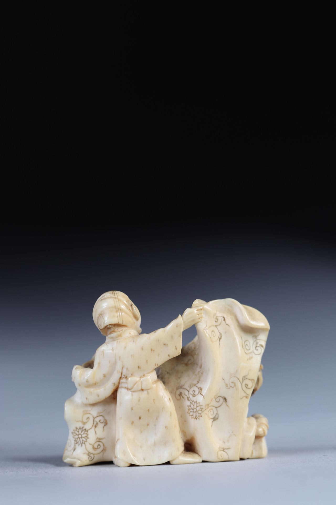 Netsuke carved from a group - figures. Japan Meiji period around 1900 - Image 2 of 3