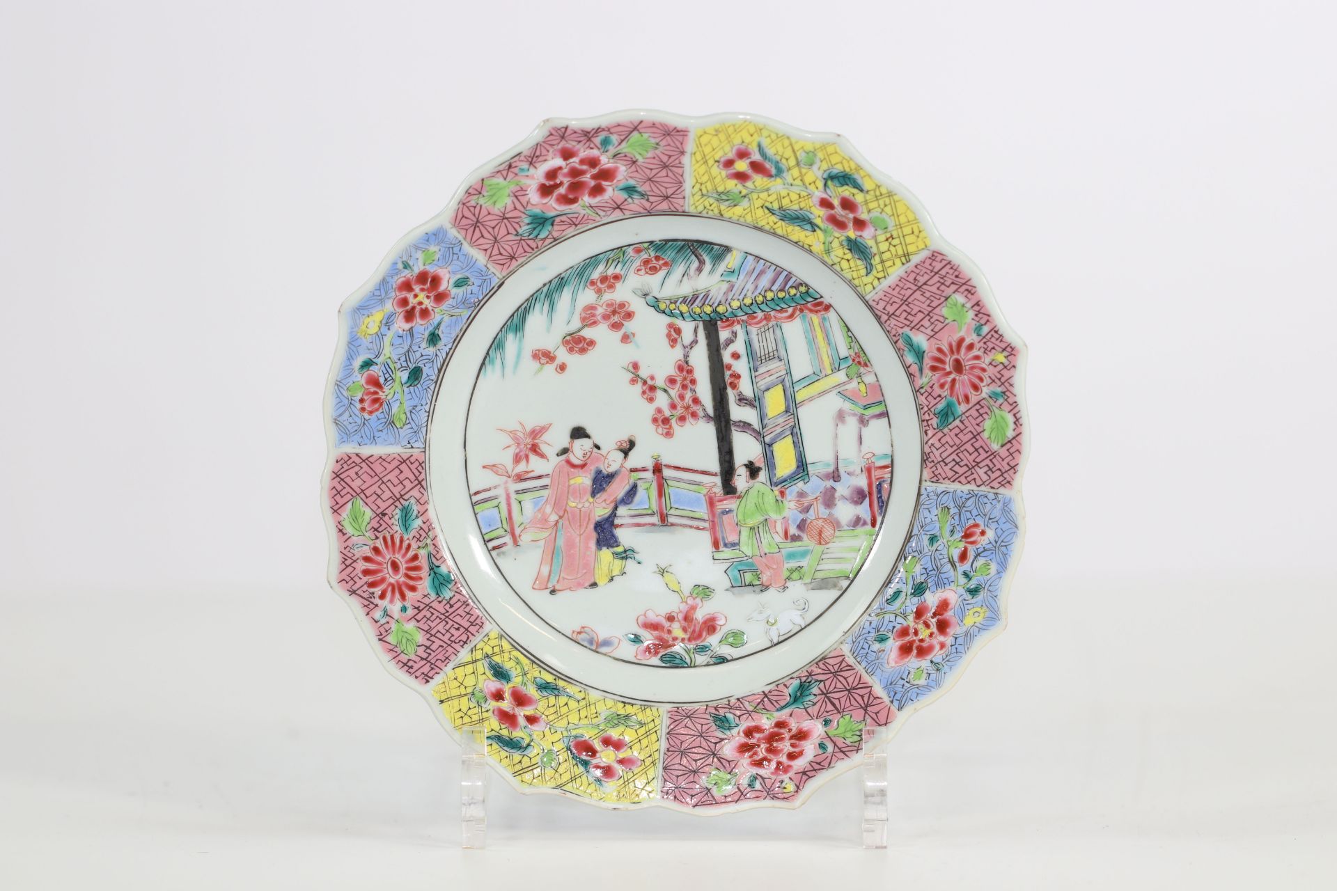 China famille rose plate with a beautiful decoration of a woman in the garden 18th