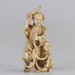 Japan Netsuke in ivory carved - two figures knocking out an octopus Meiji period 1900