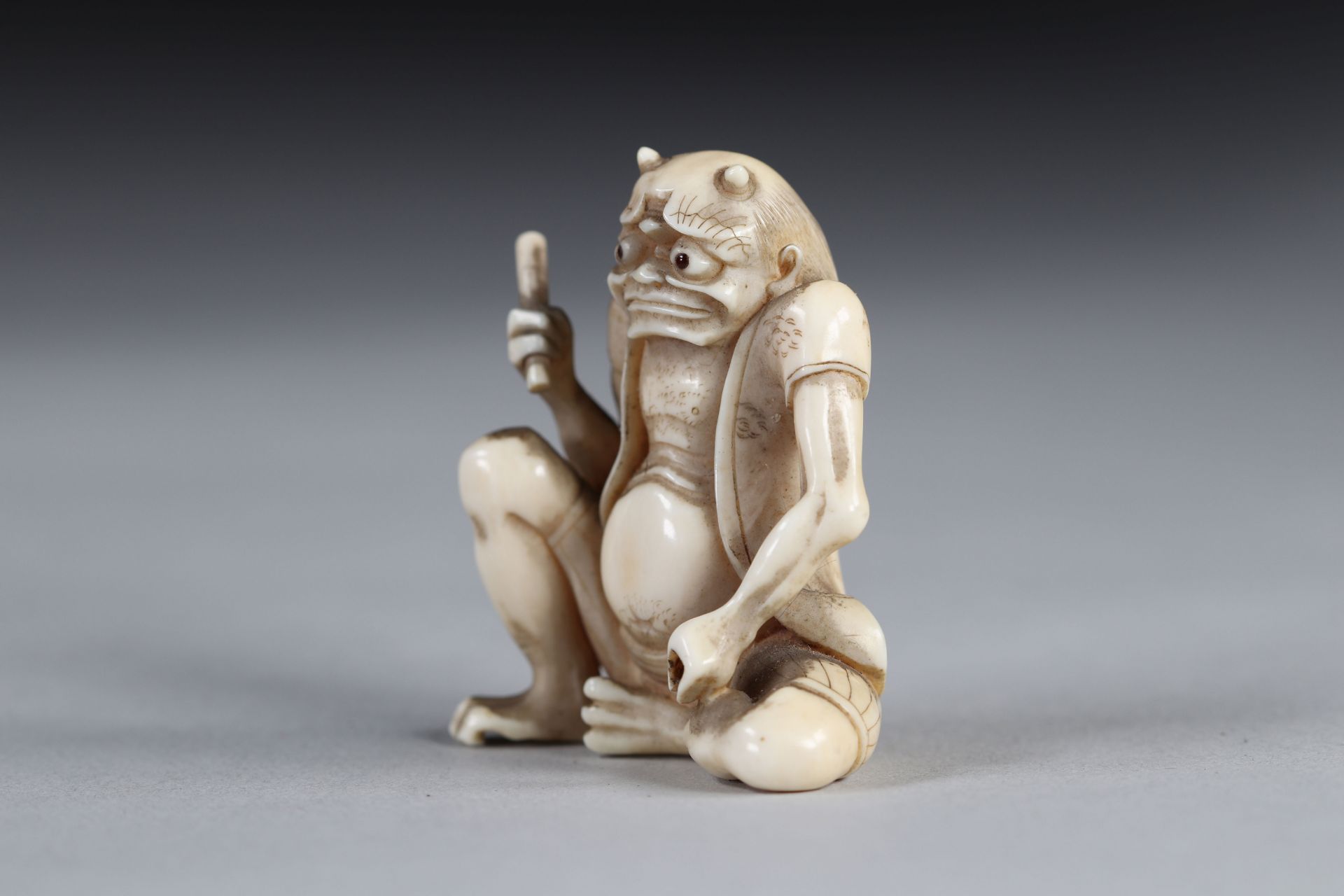 Netsuke carved - a seated Oni. Japan d"bu 20th - Image 3 of 4