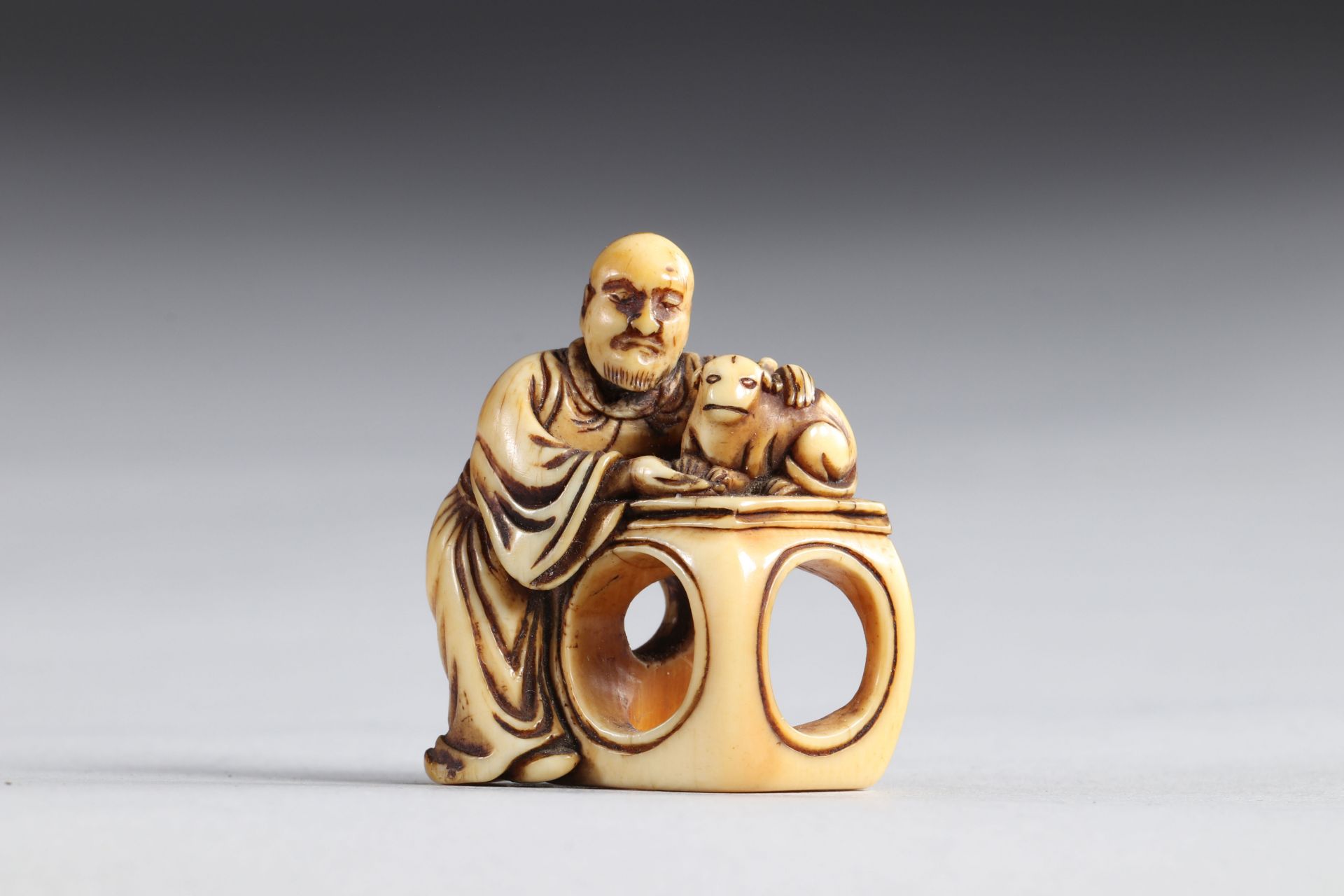 Netsuke carved - a character and an animal. Japan Edo period